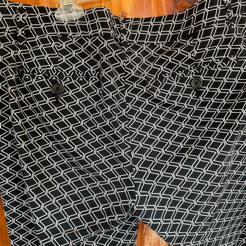 Black and white pants; front zipper and inside button. Dress up or dress down.